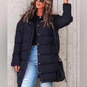 Vici – thread and supply, black pocketed puffer jacket.